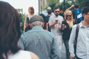 Man walking through crowd