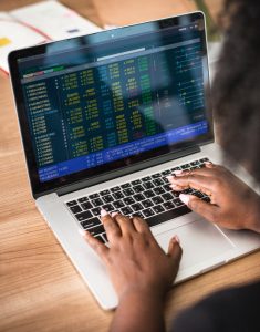 women checking stocks on computer